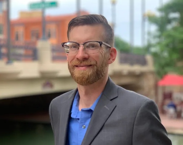 Family smiling and unpacking healthy groceries